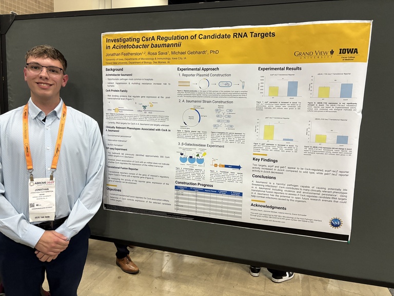 Photo of Jonathan Featherston with his poster at the 2025 ABRCMS conference