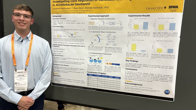 Photo of Jonathan Featherston with his poster at the 2025 ABRCMS conference